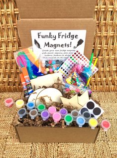 the funky fridge magnets box is filled with art supplies