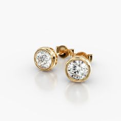 14K Yellow Gold Bezel Diamond Stud Earrings (1.00 CTW - H-I / SI1-SI2). This hand crafted, bold design accents the beauty of the round brilliant diamonds by using a thin bezel and circle accented basket. These earrings will fit snugly against the ear and features friction backs. Bezel Diamond Earrings, Diamond Earing Designs Unique, Gold Earrings Models, Gold Jewellery Design Necklaces, Beaded Collar, Notes Template, Diamond Stud Earrings, Jewelry Design Necklace, Fine Jewelry Designers