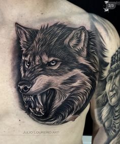 a man with a wolf tattoo on his chest