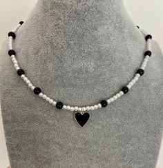 'Black heart' - modern combination of 3 mm glass pearl, 6 mm black onyx bead and black enamel heart pendant. The necklace is 15 inch in length + 1.5 inch extender. Black Pearls Necklace, Black Beaded Heart-shaped Jewelry, Black Adjustable Heart Charm Necklace, Adjustable Black Heart Charm Necklace, Trendy Black Jewelry With Heart Beads, Trendy Black Heart Beads Jewelry, Trendy Black Beaded Necklaces With Round Beads, Adjustable Black Heart Pendant Necklace, Trendy Black Heart Necklace For Valentine's Day