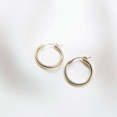 Your search for hoops is over - meet our Everyday Hoop Earrings! They're the perfect earrings to wear for any occasion. They're hypoallergenic and perfect for sensitive ears! Pick from gold fill or sterling silver - materials durable enough for everyday wear. DETAILS Gold filled -or- sterling silver click hoops Available in 3 sizes: small (13mm), medium (22mm), & large (34mm) Comes as a pair Hoop Earrings Aesthetic, Earrings Aesthetic, Simple Earrings, Favorite Rings, Sensitive Ears, Locket Necklace, Everyday Jewelry, Minimalist Earrings, Buying Jewelry