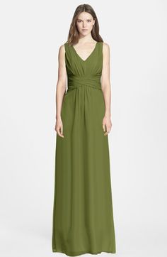 a woman in a long green dress