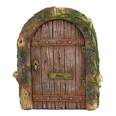 a small wooden door with moss growing on it