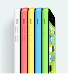 four different colored iphones are lined up in a row on a white surface,