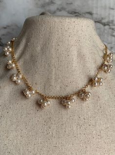 This beautiful Avon faux pearl necklace from the 1980's is in almost brand new condition and would make a perfect addition to any vintage lover's collection. There are no visible scratches or blemishes. The pearls are glass ad the chain is gold in color and 18 inches in length. Pearl Cluster Necklace, Pearl Cluster, Cluster Necklace, Faux Pearl Necklace, Vintage Lover, Vintage Avon, Gold Plated Chains, Cute Earrings, Leather Cord