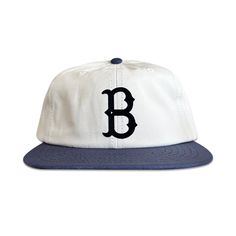 This vintage-inspired Brooklyn Dodgers hat is a grand slam. Sorry, I had to. Made from comfy organic cotton featuring a custom-designed midnight navy flocked patch. A cool two-tone hat that sits great on any shaped head. Whether you're a new Los Angeles Dodgers fan or a life-long Brooklyn Dodgers fan, scoop yours today.  * (New) Classic six-panel, unstructured design  * Brass strapback closure  * Custom JI Creative flocked Brooklyn Dodgers patch * Color: White Crown, Navy Blue Brim * Size - One Size Fits All (6 ⅝" - 7 ⅝") * Contents - 100% Organic Cotton Vintage Dad Hat For Everyday, Vintage Cap Hat For Everyday, Vintage Cap For Everyday Wear, Vintage Cap For Everyday, Vintage Everyday Cap, Classic Six-panel Trucker Hat For Streetwear, Classic Snapback Fitted Hat, Retro White Fitted Hat With Curved Brim, Vintage Six-panel Outdoor Hat