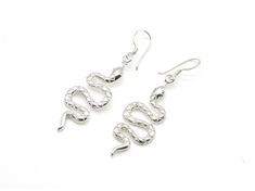 Dangling Snake Earrings made of Solid 925 Sterling Silver ☞ made to last.Click here for ☞ Snakes CollectionDetails:• Silver Snake Earrings• Dimensions: Length 2.1mm Width 1mm• Solid 925 Sterling SilverSKU TE-049 Silver Snake-shaped Pierced Earrings, Silver Snake Shape Earrings, Silver Sterling Silver Snake-shaped Earrings, Long Snake, Snake Earrings, Snakes, Long Earrings, Solid 925 Sterling Silver, Gold Vermeil