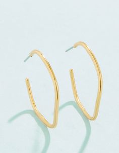 Inspired by the waves of the ocean, these lightweight Ripple Wave Hoop Earrings are perfect for a beach day or everyday. Designed to shine through everyday wear, exercise, showers and a summer at the beach in tarnish free 14kt gold vacuum plating. Cheap Hoop Earrings For Vacation, Casual Hoop Earrings For Summer, Cheap Metal Hoop Earrings For Beach, Cheap Small Hoop Earrings For The Beach, Wave Earrings Clay, Minimalist Hypoallergenic Hoop Earrings For Summer, Summer Minimalist Hypoallergenic Hoop Earrings, Trendy Gold Hoop Earrings For Beach, Modern Gold Hoop Earrings For Summer