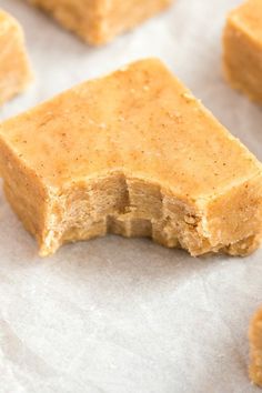 pieces of peanut butter fudge sitting on wax paper