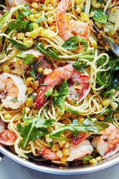 pasta with shrimp, corn and greens in a skillet