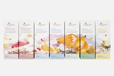 six different flavors of fruit teas in front of a white background with an orange and yellow bird on it