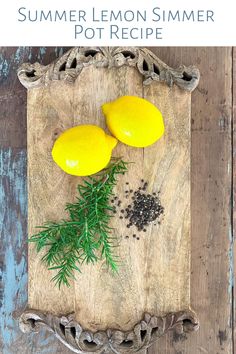 two lemons on a cutting board with rosemary and pepper sprigs next to it