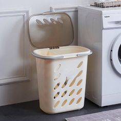 a laundry basket next to a washing machine