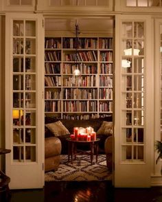 a living room filled with lots of books