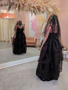 Bride in a glittery black wedding gown with a black veil looking at herself in a mirror.  The gown is a sweetheart neckline with narrow spaghetti straps and a flounced skirt. Halloween Wedding Gown, Wedding Dress Glitter, Glittery Wedding, Glitter Wedding Dress, Dress Glitter, Black Wedding Dress