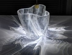 an artistic image of a glass vase with a light shining on it