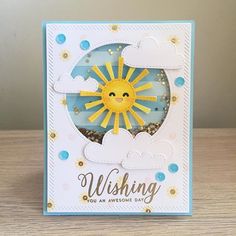 a card with the words wishing you an awesome day written in gold and blue on it