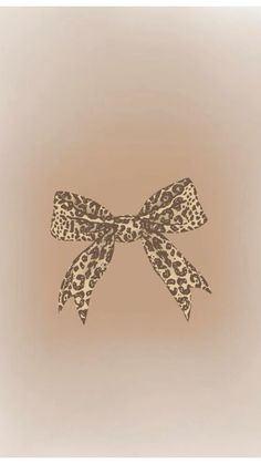 an animal print bow on a beige background with the words,'i don't know