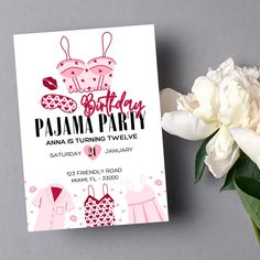 a pink and white birthday party card next to a flower