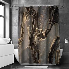 the shower curtain is decorated with black and gold marbled paint on it's walls