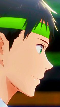 an anime character with green hair and blue eyes looking off to the side in front of a blurry background