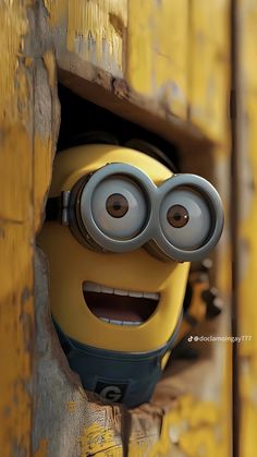 a minion peeking out from behind a yellow wall