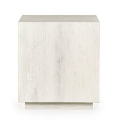 a white wooden block sitting on top of a table