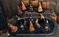 a tray filled with witches hats and pumpkins