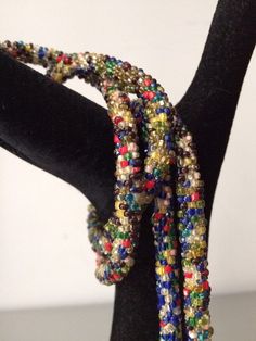 "Stunning lariat necklace from the 1920's with amazing beadwork and colors. In very good vintage vintage condition. Measurements are; From end to end 38 1/2\" Feel free to convo me with any further questions. Thank you for your interest." Adjustable Multicolor Beaded Lariat Necklace, Multicolor Beaded Lariat Necklace, Vintage Adjustable Multicolor Necklaces, Handmade Lariat Beaded Necklace For Party, Handmade Multicolor Lariat Necklace As Gift, Handmade Multicolor Lariat Necklace Gift, Beaded Multicolor Lariat Necklace For Gifts, Multicolor Beaded Lariat Necklace As A Gift, Multicolor Beaded Lariat Necklace For Gift