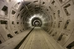 the inside of a tunnel that is very long and has lots of holes in it