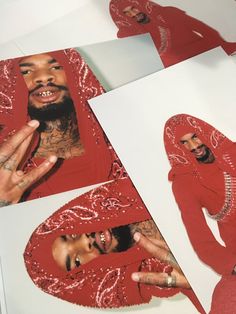 a man with tattoos on his face and wearing a red outfit next to pictures of himself