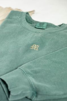 Stay cozy and stylish with the Comfort Colors or Gildan Single Letter Monogram Sweatshirt. This personalized sweater features custom initials in a stylish embroidery design. With its monogrammed fashion, this sweatshirt adds a personal touch to your wardrobe. It's a great option for those who appreciate customized and stylish clothing. All clothing and accessories from The Southern Thistle are handmade-to-order, just for you! ☺️ Our Gildan sweatshirt is made from a blend of 50% cotton and 50% polyester, ensuring comfort and durability. It features a classic fit with no center crease and a 1x1 athletic rib knit collar with spandex for added flexibility.  Experience ultimate comfort with our Comfort Colors shirt. Made from 9.5 oz. 80/20 ring spun cotton/polyester blend, this shirt offers a r Single Letter Monogram, Monogram Sweater, Mediterranean Wedding, Personalized Sweater, Monogram Sweatshirt, Comfort Colors Sweatshirt, Gildan Sweatshirt, Embroidery Works, Letter Monogram