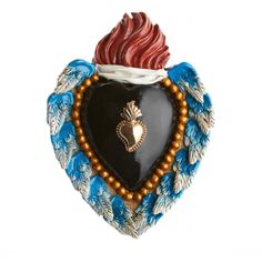 a heart shaped ornament with an angel's wing on it