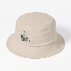 This packable, scrunchable, lightweight headwear classic is ready for adventure, from the beach to the street to the trail Breathable 100% cotton with eyelet ventilation Flat top Moderate brim is 2.2"" (5.5 cm) wide to keep the sun off your face Unstructured crown is 3.1"" (8 cm) deep Easy care: just spot clean and dry in shade. A tribute illustration to Jacques Tati, the great French mime, filmmaker, actor and screenwriter. Casual Lightweight Packable Bucket Hat, Vintage Cotton Hat For Outdoor Activities, Vintage Cotton Hats For Travel, Vintage Cotton Travel Hat, Casual Beige Canvas Bucket Hat, Cotton Bucket Hat For Travel, Cotton Bucket Hat, One Size Fits Most For Travel, Summer Bucket Hat For Outdoor Activities, 5-panel, Summer Cotton Sun Hat For Outdoor Activities