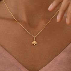 This delicate Serenecharm lotus charm is a beautiful and symbolic piece of jewelry. The lotus flower is a symbol of purity, enlightenment, and rebirth. It is a flower that grows in muddy waters, but rises above the mud to bloom in beauty. This charm is perfect for anyone who appreciates beauty and symbolism. It would make a great gift for a special someone or as a treat for yourself. The charm is also very versatile, and can be added to a necklace, bracelet, or keychain. Material: BrassFinishing: 18K Gold Plate over Brass / Rhodium PlatingLotus Size: 10mm x 9.4mmWeight: 1.9g Dainty Flower Pendant Jewelry For Meditation, Lotus Flower Necklace, Dainty Chain Necklace, Lotus Mandala, Lotus Pendant, Gold Lotus, Lapis Lazuli Earrings, Muddy Waters, Brass Charms