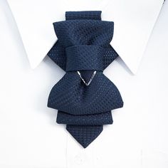 "Hopper tie is original product, presented by Ruty Design. This unisex accessory is a modern combination of elements found on traditional ties and bow ties. It is recommended not to tighten the regulation strip too much: Hopper tie is at its best when leveled up with the collar line. Freestyle fashion lovers should bear in mind that this accessory also looks great with the collar unbuttoned.  The bow tie is attached to an adjustable strap. Fitting approx 50-53 cm /19.7-20.9 in. neck size Name: H Dapper Blue Tie For Gift, Dapper Blue Tie Suitable For Gift, Dapper Standard Ties For Gift, Dapper Blue Tie As Gift, Dapper Ties As Gifts, Dapper Standard Ties As Gifts, Blue Elegant Tie For Father's Day, Modern Blue Ties For Formal Occasions, Elegant Blue Tie For Father's Day