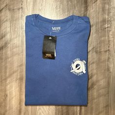 Item Is Nwt. Color Is Blue. Material Is Cotton (100%). Size Is A Men’s Small. Pit Measurement - 19” Total Length - 25” Np664 Vans Blue Short Sleeve Tops, Blue Short Sleeve Vans Top, Blue Cotton Vans Top, Blue Cotton Vans Tops, Vans Shirts, Vans Top, Vans Shirt, Vans Blue, Vans Off The Wall