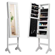 a white lighted jewelry cabinet next to a mirror