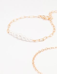 Add charm to your look with this set of four gold paperclip and chain bracelets. Featuring elegant pearl styles, playful paperclip designs, and delicate chain styles, mix and match to your heart's content. Dimensions: Length: 15.5 cm Extender: 6 cm | Lovisa Gold Pearl Paperclip Chain Bracelet 4-Pack Chain Bracelets, Delicate Chain, Gold Pearl, Paper Clip, Chain Styles, Mix And Match, Chain Bracelet, Bracelet, Chain