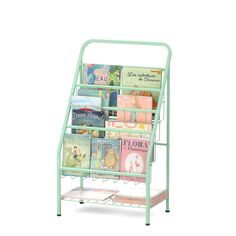 a green metal book rack with books on the top and bottom shelves filled with children's books