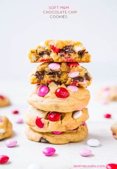 three cookies stacked on top of each other with pink and white sprinkles