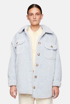 - color: light blue    - fabric: heavyweight non-stretch sherpa  - collared neck and button placket  - long sleeves with button cuffs  - split curved hem  - flap breast pockets  - shell: 100% polyester  - lining: 51% polyester/49% cotton  - dry clean    - style #: 1jakt00762    mpn  1jakt00762    sku  alcwfw23-04 Light Blue Single Breasted Long Sleeve Outerwear, Light Blue Single-breasted Long Sleeve Outerwear, Light Blue Long Sleeve Outerwear With Buttons, Light Blue Winter Outerwear With Buttons, Blue Winter Shacket With Pockets, Trendy Light Blue Button-up Outerwear, Light Blue Button-up Fall Outerwear, Blue Collared Outerwear With Buttoned Pockets, Light Blue Button-up Outerwear For Fall