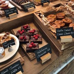 various pastries and desserts on display at a bakery