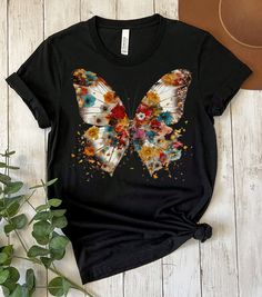 Butterfly Floral Shirt, Butterfly Shirt, Butterfly Graphic Shirt, Aesthetic Butterfly Shirt, Flowers Gift Shirt, Butterfly Gift, Womens Gift Unisex adult sizing.   Ideal for any situation, a unisex heavy blend crewneck sweatshirt is pure comfort.  Made with a medium-heavy fabric blend of 50% cotton and 50% polyester, this sweatshirt feels cozy and is the perfect choice for those colder months. Fabric blends: Heather Sport colors - 60% polyester, 40% cotton. Fabric blends: Ash and Heather Prism colors - 99% Airlume combed and ring-spun cotton, 1% polyester; Heather colors - 52% cotton, 48% polyester; Athletic Heather and Black Heather - 90% cotton, 10% polyester. Rolled sleeves in picture is for styling purposes only. Props used in photos are NOT included with purchase. WASHING INSTRUCTIONS Butterfly Tee Shirt, Casual Summer Tops With Printing, Casual Printed Tops For Summer, Trendy Butterfly Print Crew Neck Tops, Trendy Crew Neck Tops With Butterfly Print, Casual Summer Shirt With Printing, Casual Printed Summer Tops, Summer Crew Neck Top With Printing, Summer Printed Crew Neck Top