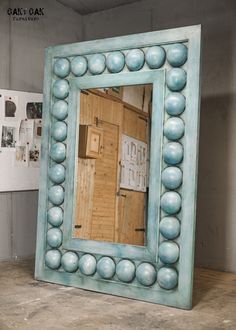 there is a large blue frame with balls on it