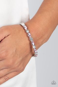 A sparkly collection of round white rhinestones and marquise pink rhinestones alternate across the top of the wrist, coalescing into a stackable bangle-like bracelet. Features a hinged closure.

Sold as one individual bracelet. Stackable Bangles, Hinged Bracelet, Paparazzi Accessories, Sliding Knot, White Rhinestone, Rhinestone Bracelet, Paparazzi Jewelry, Pink Rhinestones, Pink Bracelet