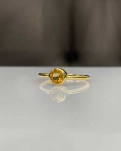 Natural Citrine Bezel Setting Ring * 14K Solid Gold * Genuine Gemstone * Best Gift for her * Handmade Ring ◎ Details ◎ ○ Gemstone Details .Natural CITRINE Round Cut 4.00 mm approx. 0.35 ct ○ Gold Details 14K Solid Gold Width of Band : 1.60 mm Weight of Ring : approx 2.20 gr Made to Order HANDMADE ITEM ○ Upgrade to Solid 18K Gold, please click the link below: https://www.etsy.com/listing/962826004 ○ CITRINE Rings : https://etsy.me/3hAkBKI All of our jewelleries are designed, created and manufactu Handmade Yellow Gold Birthstone Ring For Anniversary, Adjustable Gold Sapphire Ring Gift, Gold Sapphire Ring Gift, Fine Jewelry Yellow Sapphire Ring Gift, Yellow Gemstone Birthstone Ring As Gift, 14k Gold Amber Rings As Gift, Stackable Citrine Rings As A Gift, 14k Gold Amber Rings For Gift, Citrine Gemstone Birthstone Ring As Gift