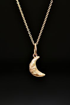 "A hand carved and cast sculptural little crescent moon pendant makes the perfect goddess necklace. Over sized hammered bail. On a short delicate cable chain with an S hook clasp. Bright shiny 14 karat yellow gold. Each is handmade individually by the artist, Miche McClendon, in her Laguna Beach studio/gallery. The moon is a symbol femininity, creativity, balance, change, growth and transformation. Specifically the crescent moon is known to symbolize fertility, intuitiveness, psyche, motherhood Beach Studio, Crescent Pendant, Festival Necklace, Witch Necklace, Witch Earrings, Celtic Pendant, Celtic Necklace, Crescent Necklace, Goddess Necklace