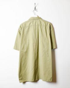 Label size X-Large Recommended size X-Large How it fits Oversized Pit to pit 26″ Shoulder to bottom 32″ Flaws See products images Material Era 00s Colour Neutral Vintage Oversized Shirt With Pockets, Oversized Khaki Cotton Shirt, Loose Vintage Cotton Shirt, Oversized Vintage Green Tops, Oversized Green Vintage Top, Green Oversized Vintage Top, Cotton Khaki Tops For Daywear, Skater Brands, Workwear Shorts