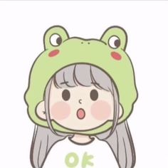 a girl wearing a frog hat with the word o'on it in front of her face